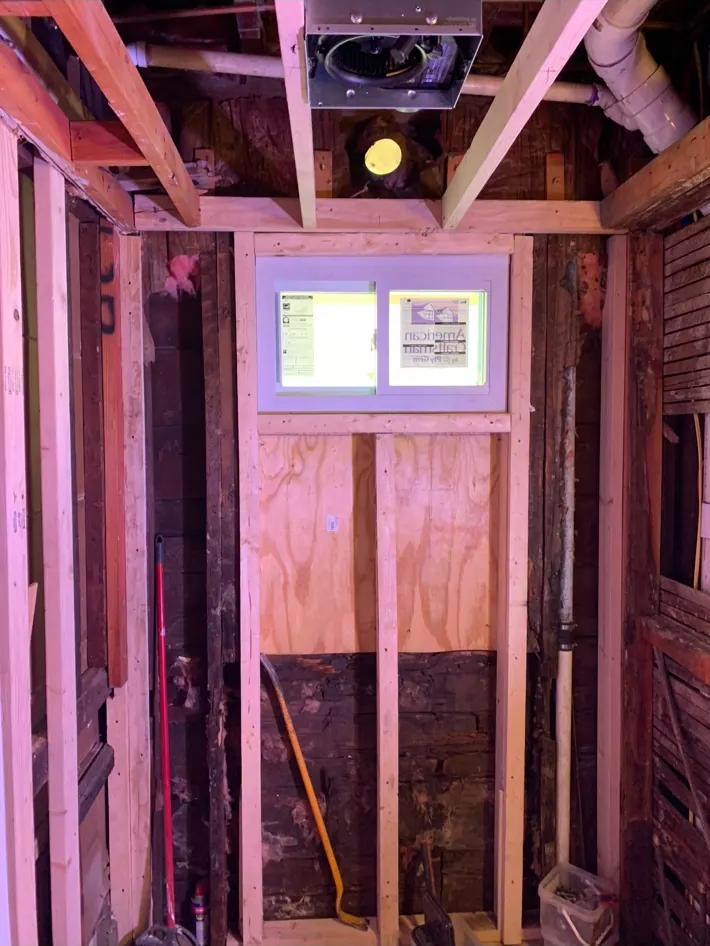 Bathroom remodel with walls opened and new framing installed
