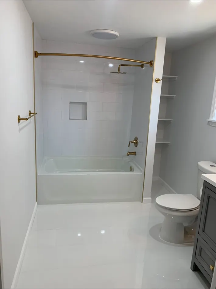 Finished white tiled tub and shower