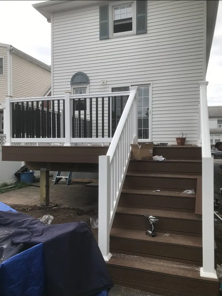 Deck stairs and railing being installed