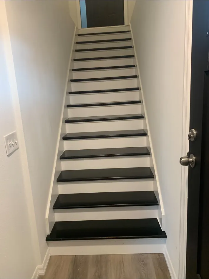 Finished black and white interior staircase