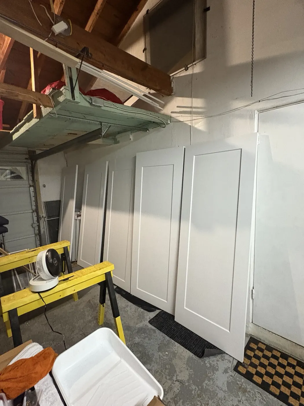 New shaker-style doors being painted and finished